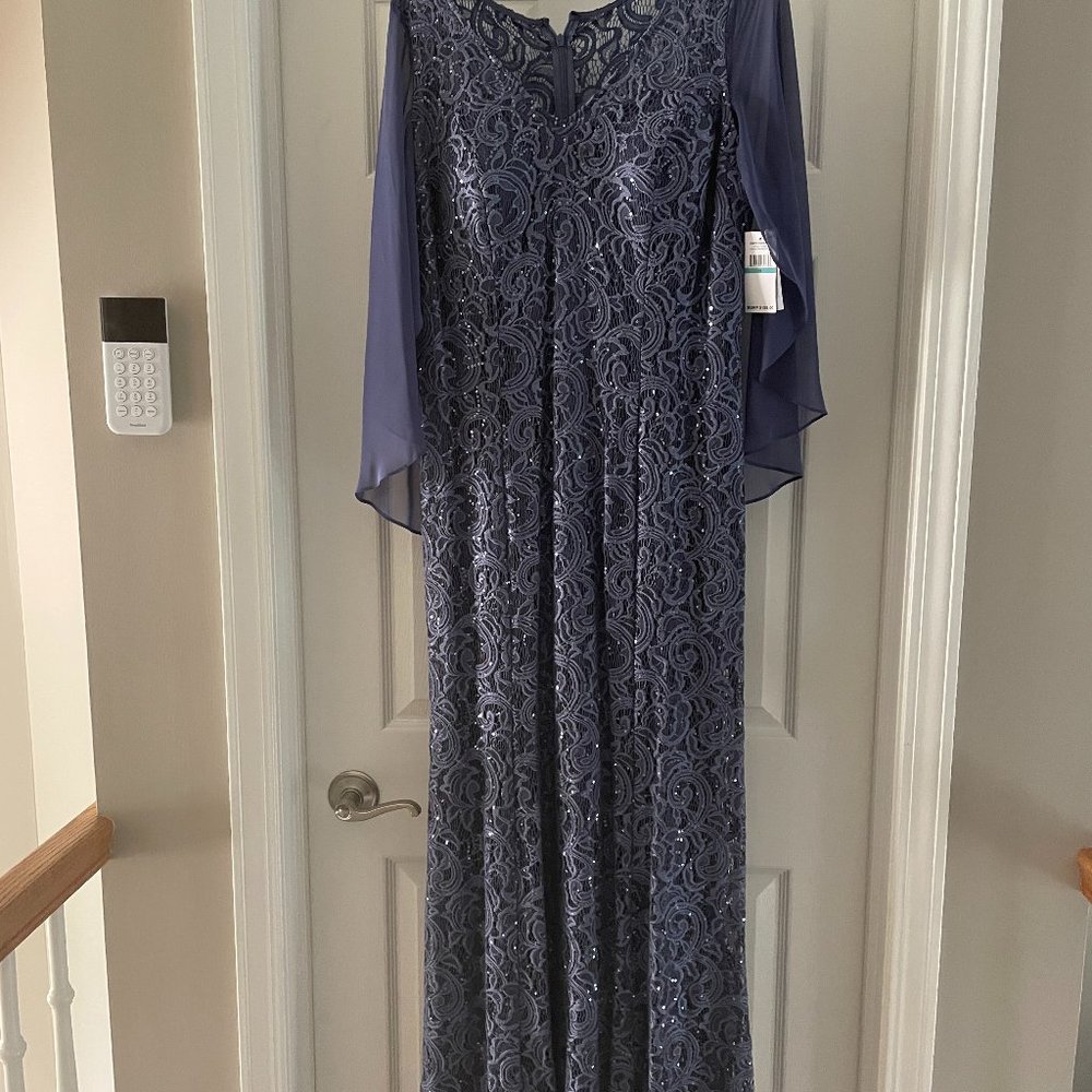Ignite evenings gown . Gorgeous Blue Sequins with Cape very flattering . NWT